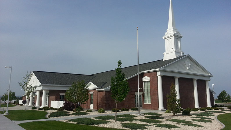 LDS Chapel with white columns and red brick