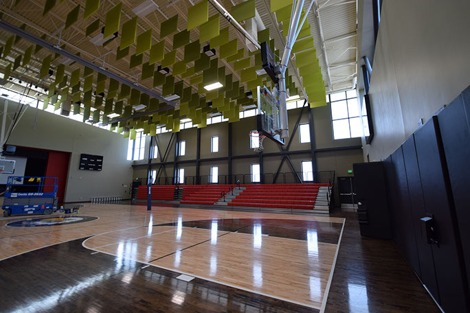 C. Mark Openshaw Education Center and Office Building gym finished floor and basketball hoops
