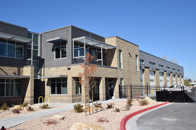 Kearns Improvement District exterior with gate and landscaping