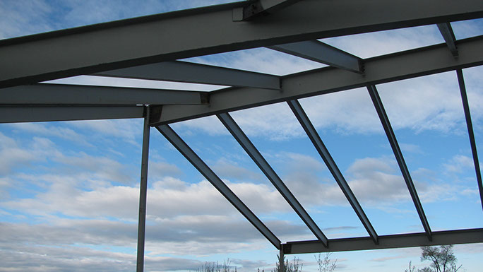 Utah State Univerisity Kaysville Campus steel roof framing with sloped beams and ridge beam